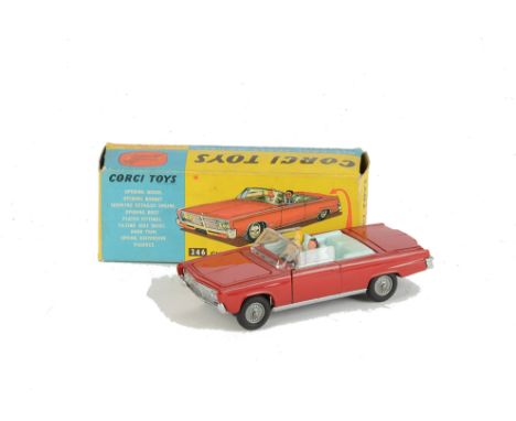 A Corgi Toys 246 Chrysler Imperial, red body, pale blue interior, driver and passenger, golf trolley in boot, detailed cast h