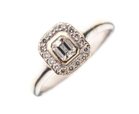 Diamond cluster ring, the emerald cut diamond rubover set within a border of brilliant cut diamonds, size V, sponsor's mark '