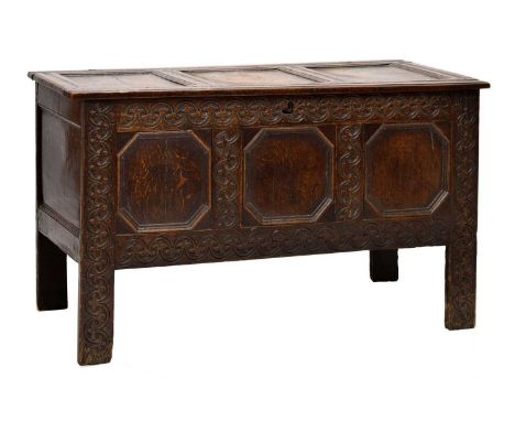 Late 17th century oak three-panel coffer or bedding chest, the hinged plain channel-moulded top, enclosing a 'candle' trough,
