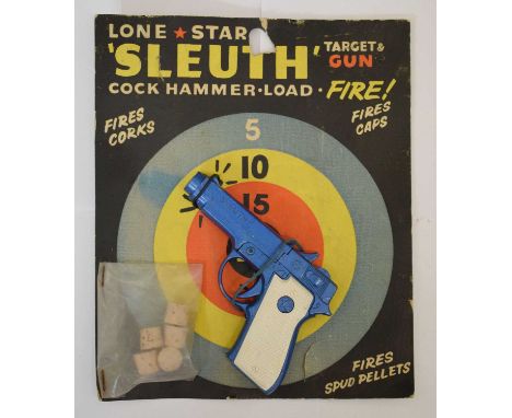 Vintage Lone Star 'Sleuth' pistol with cork ammunition, with its original card backing