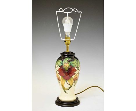 Moorcroft Pottery - 'Anna Lilly' pattern baluster table lamp, mounted on turned base, 30cm high (ex.fitting and shade)