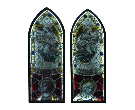 Pair of late 19th or early 20th Century leaded stained glass panels, each of lancet arched form, decorated with a kneeling an