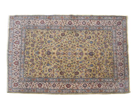Middle Eastern (Persian) wool rug or carpet, of Kashan type, the sage green ground with allover foliate scrollwork, within iv