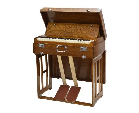 Mid 20th century oak cased 'Pearl River' pedal-operated travelling harmonium or organ having chromed mounts, folding base, th