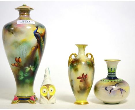 Four items of Worcester china comprising Hadleys vase, modern owl candle snuffer and two vases painted with peacocks (both va