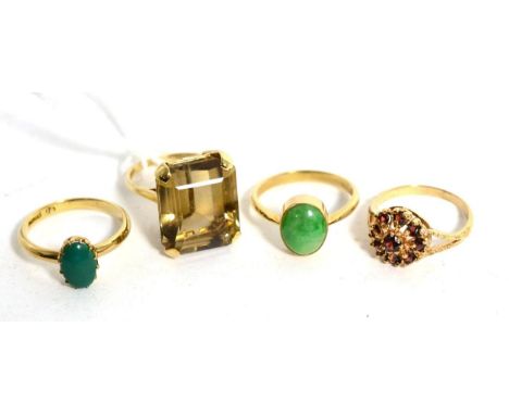 A 9 carat gold citrine ring, an octagonal cut citrine in a claw setting, finger size K1/2, a turquoise ring, finger size N1/2