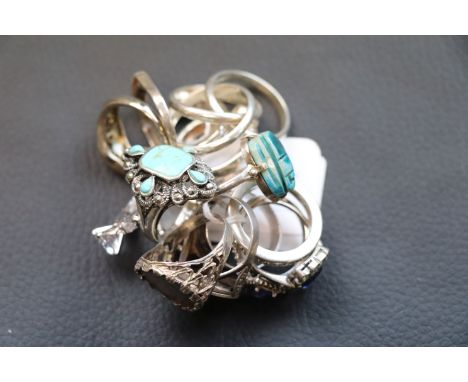 Approximately seventeen silver and white metal rings to include ceramic scarab beetle ring, Siam silver ring, synthetic opal 