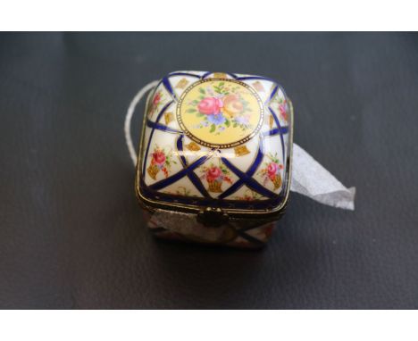 Continental handpainted 20th century Limoge  trinket box containing four miniature scent bottles, floral basket decoration, s