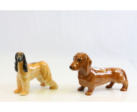 Beswick ceramic models of a Dachshund and a champion Afghan Hound, with rubbed marks to foot