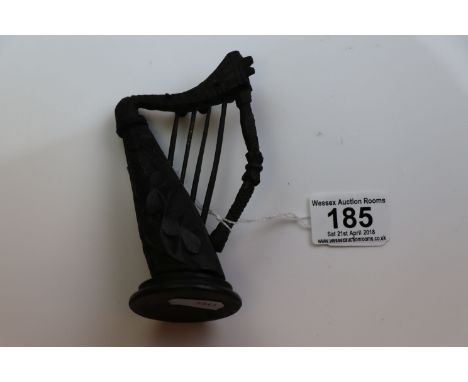 Irish bog oak novelty harp ornament with carved shamrock decoration, height approximately 13cm