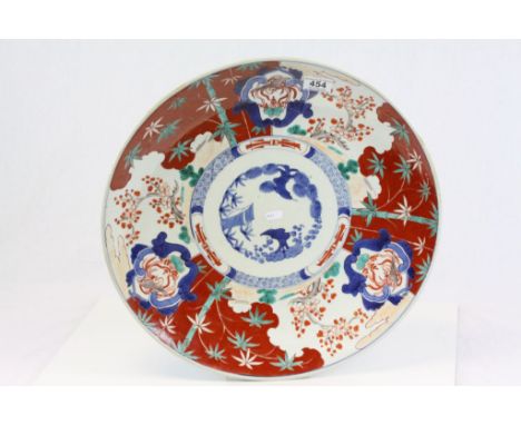 Large Oriental ceramic charger with birds, bamboo and lotus blossom decoration