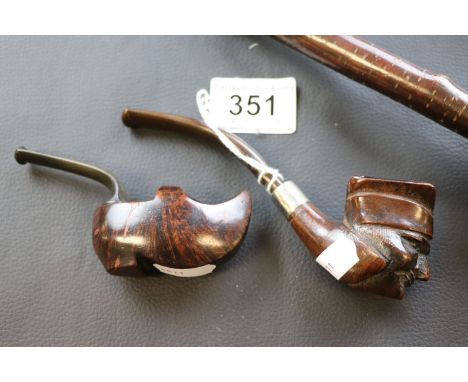 A novelty hardwood tobacco pipe in the form of  clog, a hardwood tobacco pipe carved as a face together with two carved face 