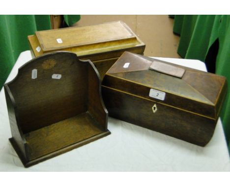 A burr yew caddy, a satin birch caddy and a small Edwardian book rack, (3).