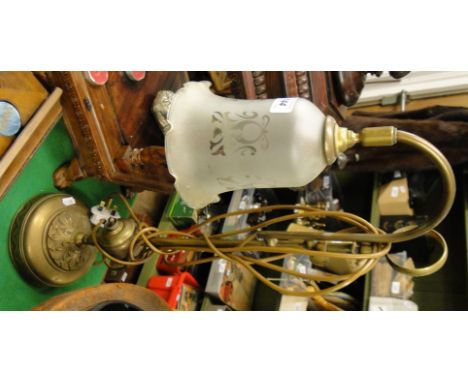 An adjustable brass Antique table lamp with shade.
