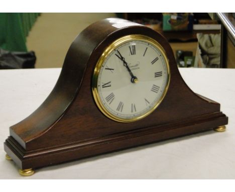 A mahogany cased mantel clock by Comitti, London.