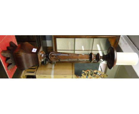 A carved hardwood pricket candlestick.