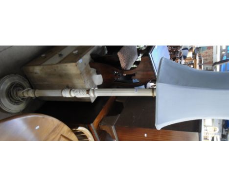 A cream painted carved and fluted standard lamp.
