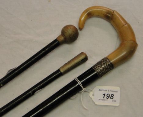 A horn handled walking stick with silver collar, a swagger stick and another, (3).