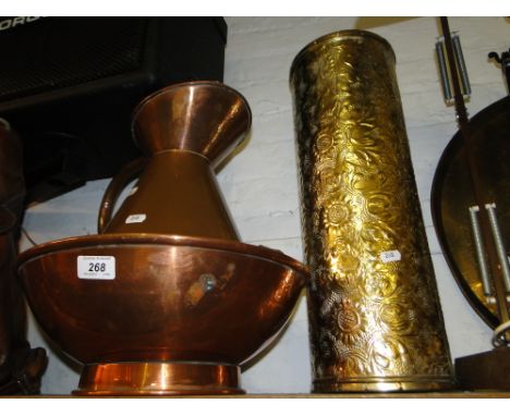 A copper wash jug and bowl and an embossed brass stick stand.