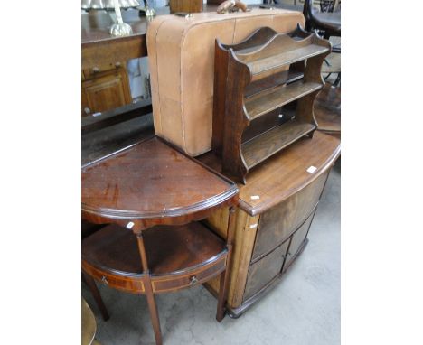 A Georgian mahogany bow front commode, with rising lid, cupboard doors under on bun feet, a leather suitcase, 2 hanging stand