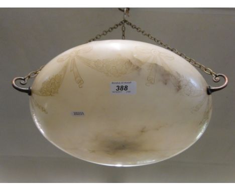 An Art Deco ceiling light bowl with swag decoration.