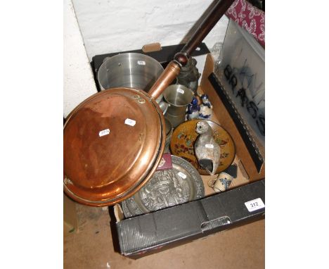 A box of various items and bed warming pan.