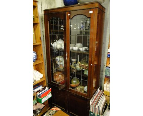 An Edwardian mahogany bookcase with 2 lead light glazed doors, height 5'11".