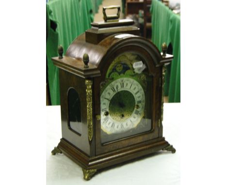 A burr walnut cased 3-train mantel clock with brass dial and moonphase.