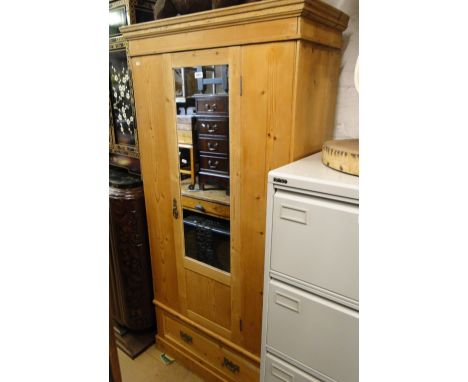 A pine single mirror door wardrobe.