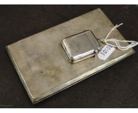 A engine turned silver cigarette case and a Victorian silver vesta case 8.6oz