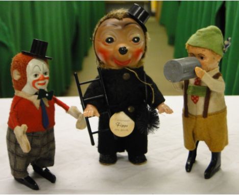 2 Schuco clockwork figures and a Fipps clockwork chimney sweep, (3).