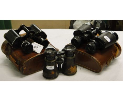 2 Leather cased binoculars, and another with inset compass.