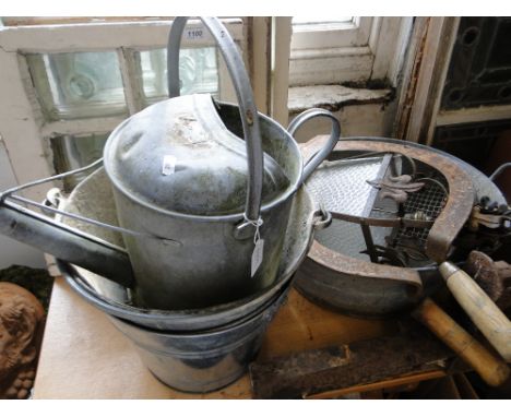 A galvanised watering can, buckets, lantern, bin, etc.