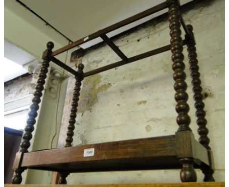 An Edwardian bobbin turned stick stand.