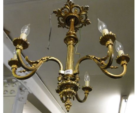 An ornate gilt metal 6 light chandelier.