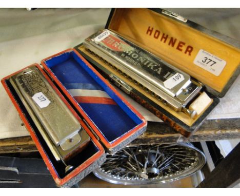 A Hohner Chromonika III shift key harmonica in C, overall length 18cm, cased and a Hohner Super Chromonica Chromatic harmonic