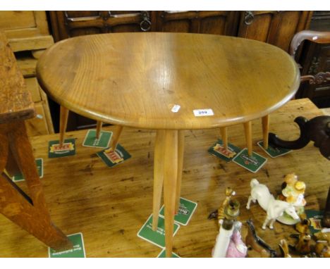 A nest of 3 Ercol elm pebble top occasional tables.