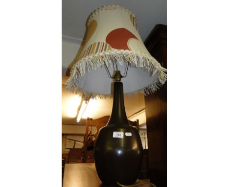 A pottery table lamp and shade.