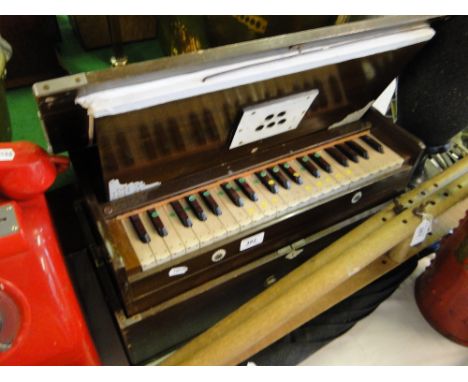 Indian portable bellows harmonium by maker "Specially Made."