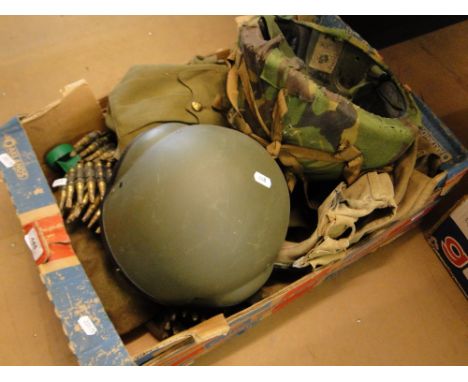 Box of military items including helmets and Army jacket.