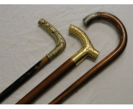 A walking stick with white metal mount and 2 others, (3).