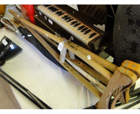 Pair of wooden crutches, umbrella, shooting stick, etc.