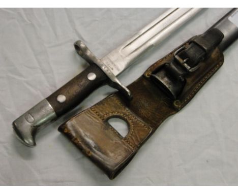 A Swiss bayonet in steel and leather scabbard No. 20994.