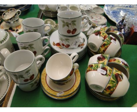 Royal Worcester "Evesham Vale" teaset for 8-people and Royal Doulton cups and saucers.