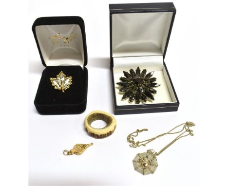 A SMALL COLLECTION OF VINTAGE JEWELLERY  Comprising a 9ct gold bellow shaped charm weight 0.7g, a white metal spider in web p