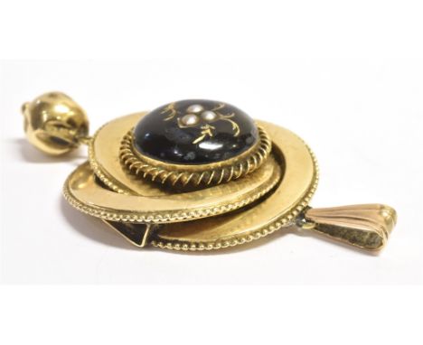 A LATE 19TH/EARLY 20TH CENTURY BLACK ENAMEL AND SEED PEARL PENDANT the circular pendant with bell drop feature, set with a bl