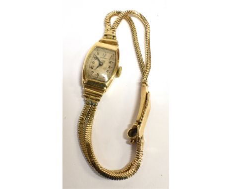 A VINTAGE 9CT GOLD LADIES ROTARY WRISTWATCH  fitted with a tonneau case, bracelet strap marked 9ct, weight 15g, case measurem