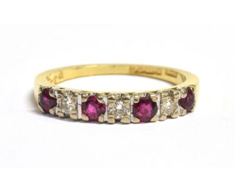 VINTAGE 18CT GOLD, DIAMOND AND RUBY HALF ETERNITY RING the ring set with three alternating diamonds and four rubies, hallmark