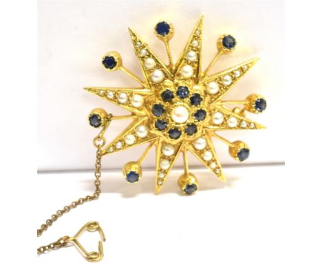 A 9CT GOLD, SAPPHIRE AND SEED PEARL STAR BURST BROOCH The brooch set with 16 sapphires and numerous graduated seed pearls, fi