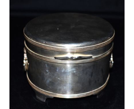 ASPREY LONDON:- A GEORGE V SILVER BISCUIT BOX  the round box with reeded band decoration to lid and body, two hinged shell pa